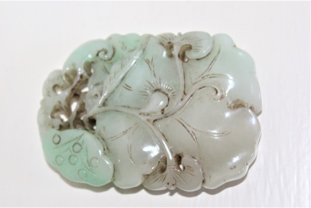 Chinese finely carved and pierced jade pendant of a lotus flower Circa 1880 to 1920 View V