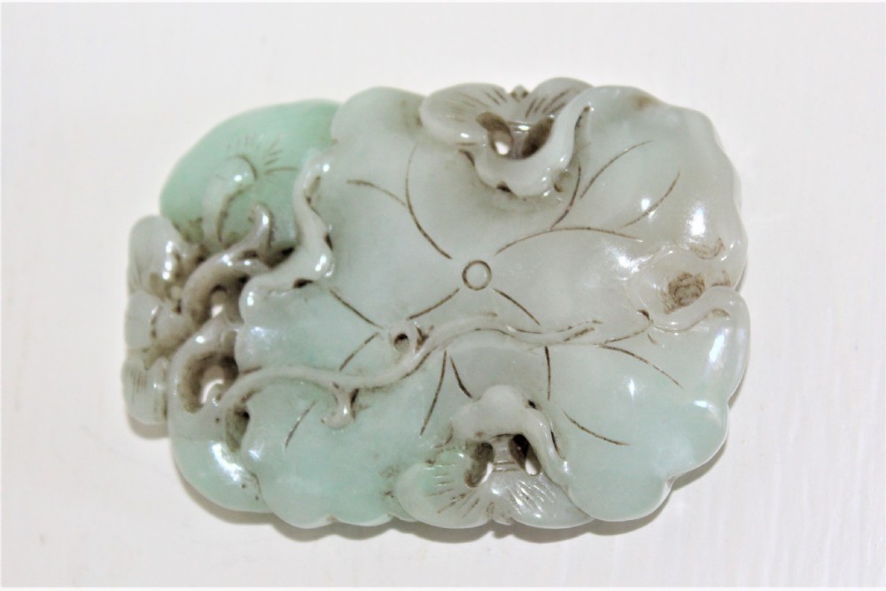 Chinese finely carved and pierced jade pendant of a lotus flower Circa 1880 to 1920 View VI
