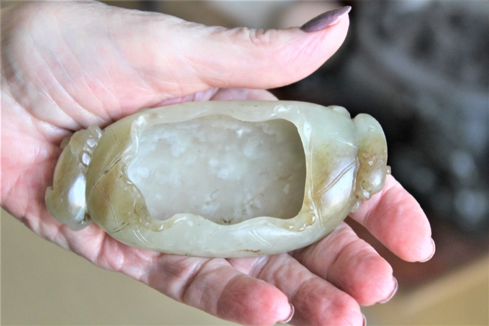 A Chinese carved jade brush washer in the form of a lily pad with an animal on each end  View VI