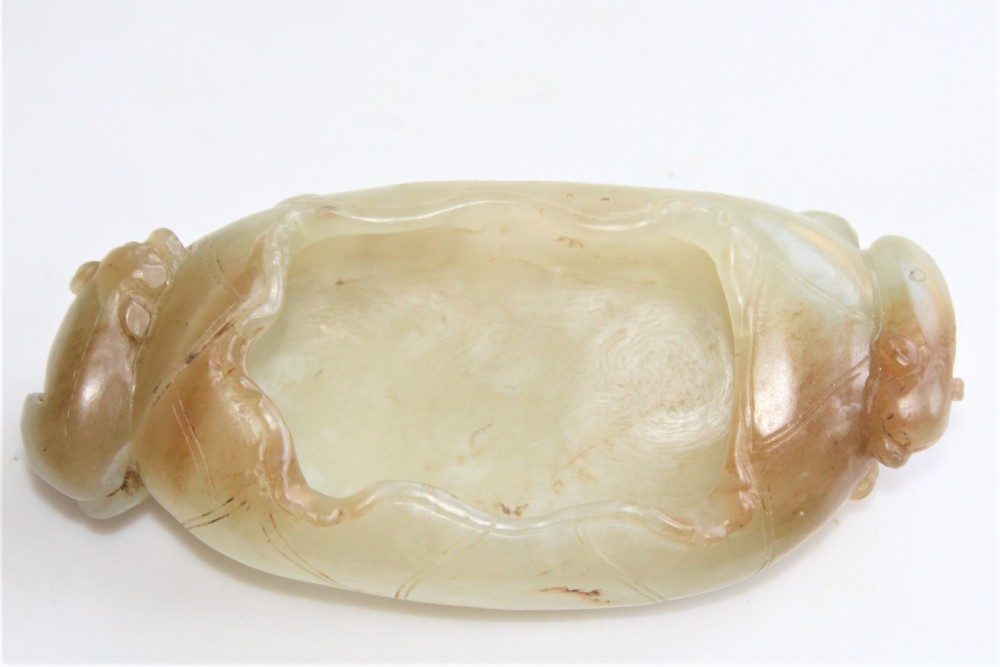 A Chinese carved jade brush washer in the form of a lily pad with an animal on each end  View VII