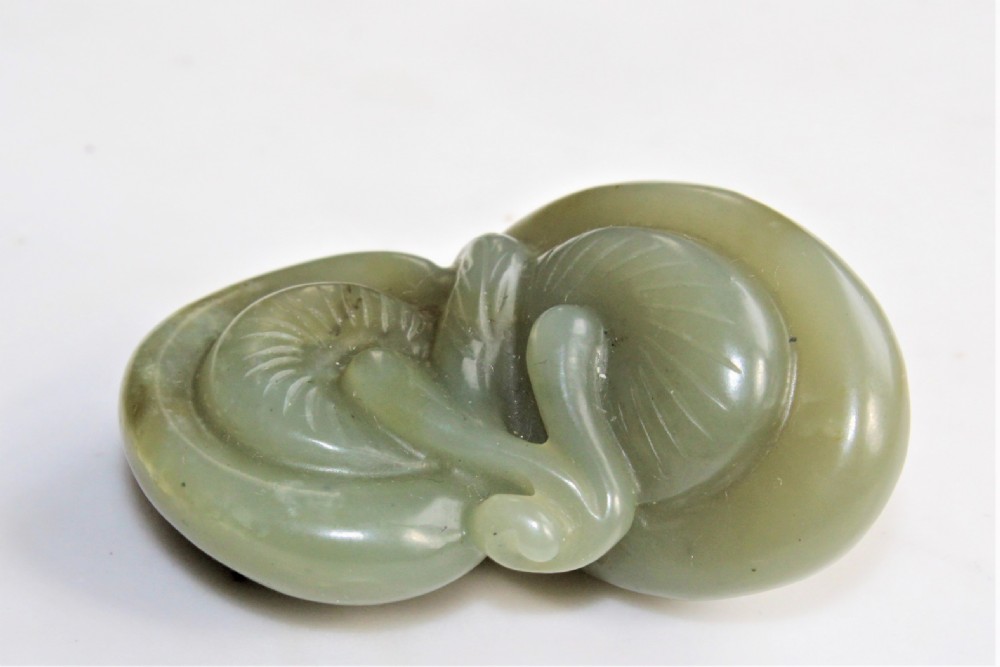 A well carved Chinese green jade Lingzhi Fungus pendant or netsuke Circa 1880 to 1920 View IV