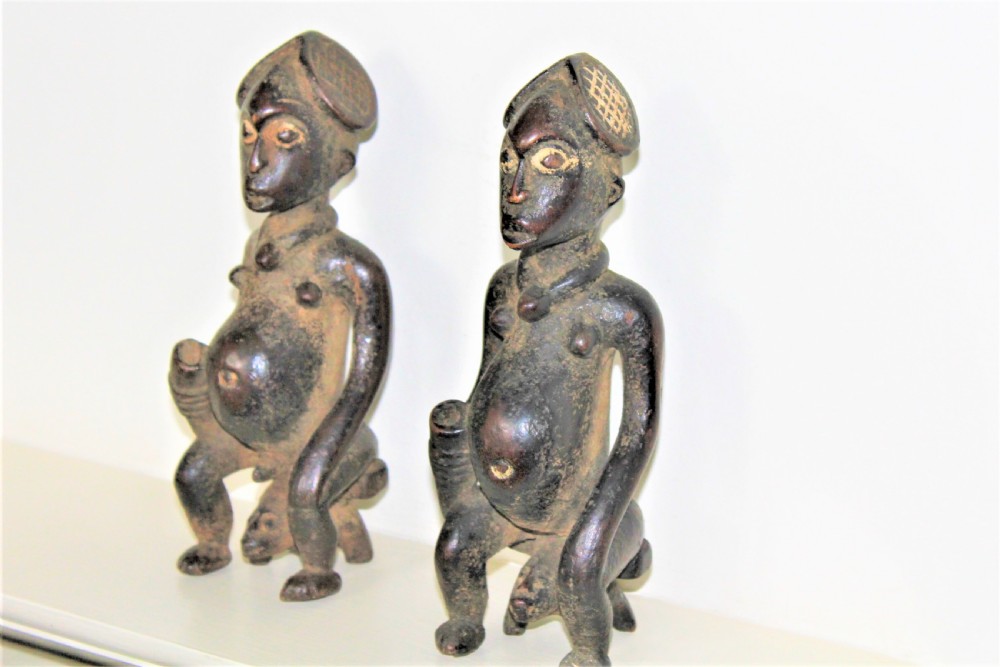 A finely carved and charming pair of Yoruba wood figurines with elaborate headdress and pigments  View II