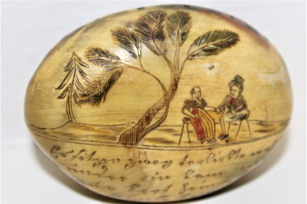 A small charming scrimshawed horn snuff box depicting a couple under a tree holding hands German Circa 1800 to 1850 View VI