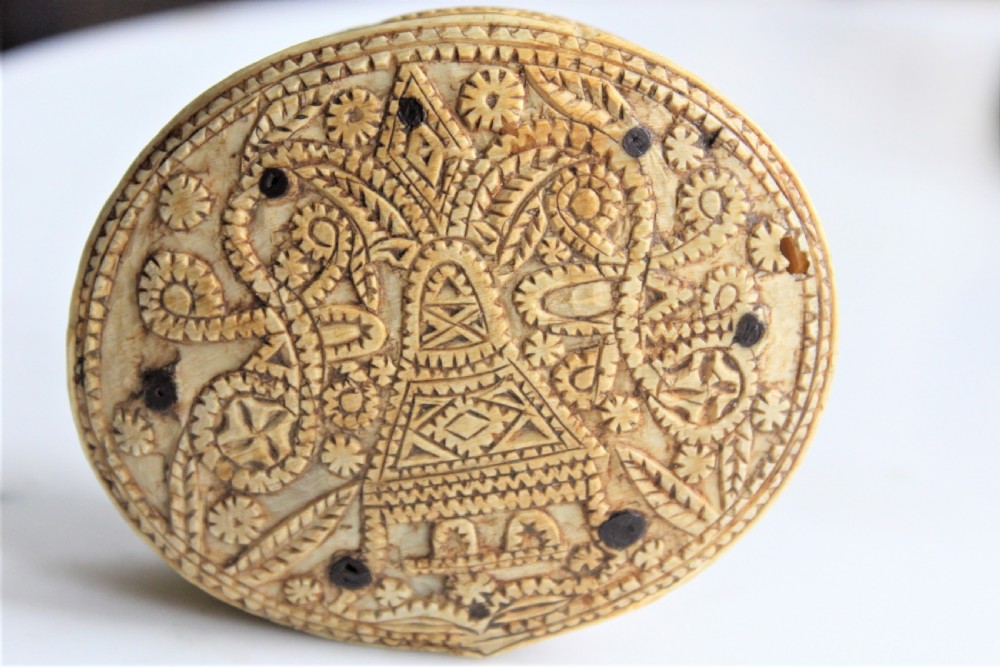 A rare 15th century carved bone hinged box dated 1488 of oval form with overall carved decoration  View XI