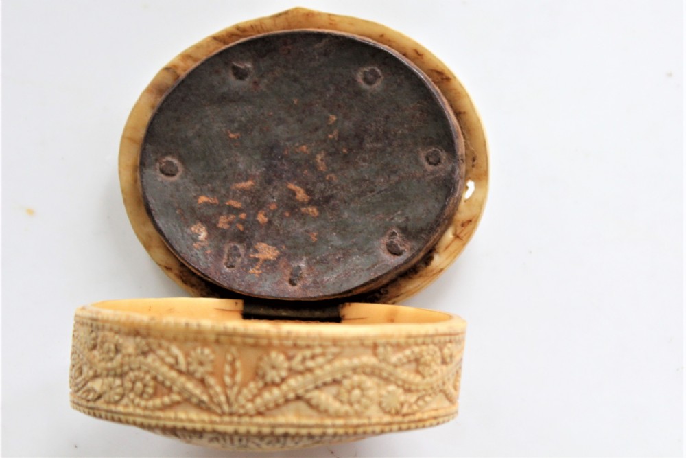 A rare 15th century carved bone hinged box dated 1488 of oval form with overall carved decoration  View V