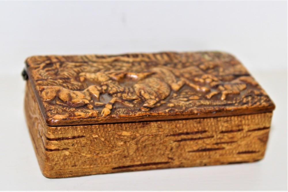 A 19th century Swedish relief carved birch wood snuffbox depicting a hunting scene  View II