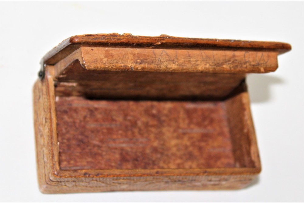 A 19th century Swedish relief carved birch wood snuffbox depicting a hunting scene  View III