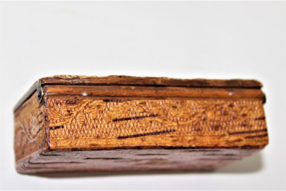 A 19th century Swedish relief carved birch wood snuffbox depicting a hunting scene  View V
