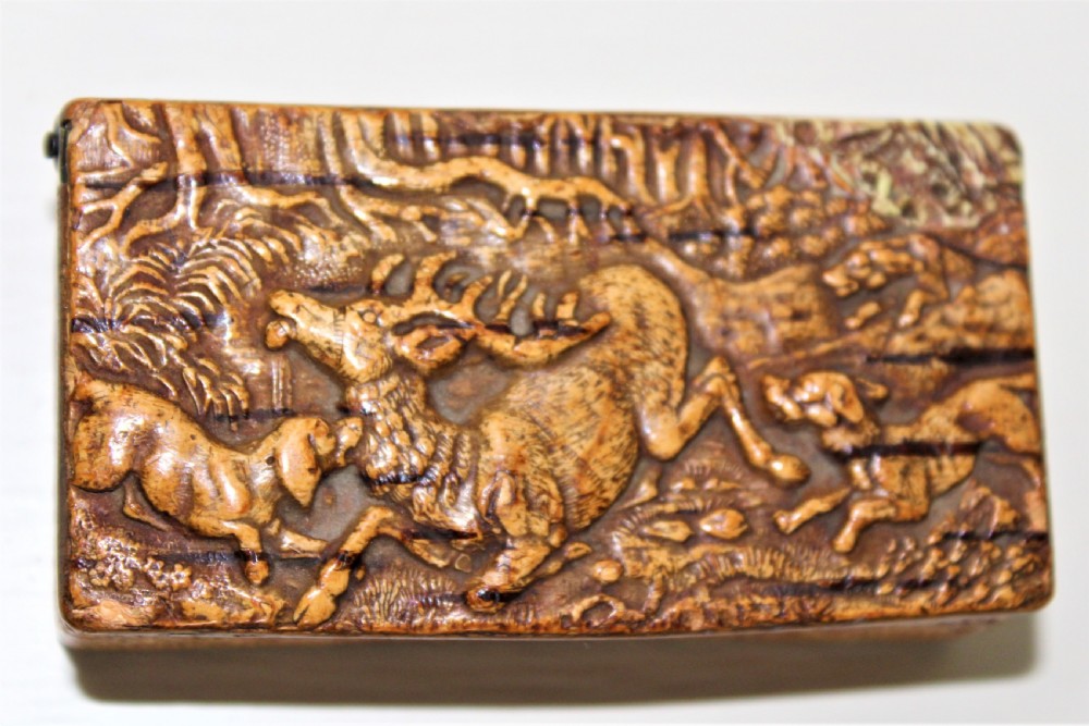 A 19th century Swedish relief carved birch wood snuffbox depicting a hunting scene  View VI