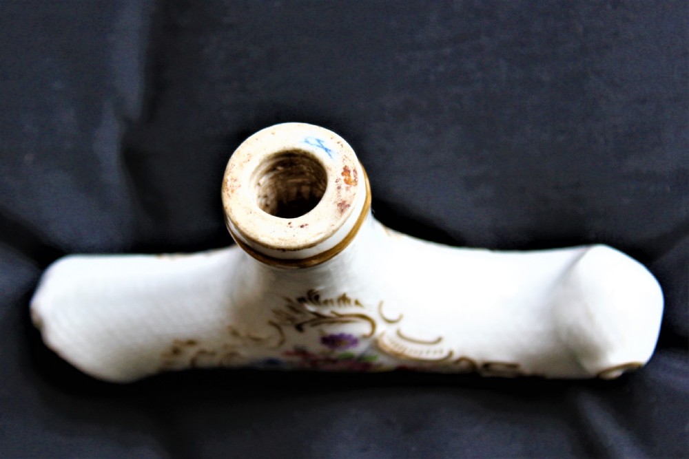 A white porcelain T-shaped walking stick handle decorated with hand-painted polychrome flowers and gilded scrolling scrollwork. View VI