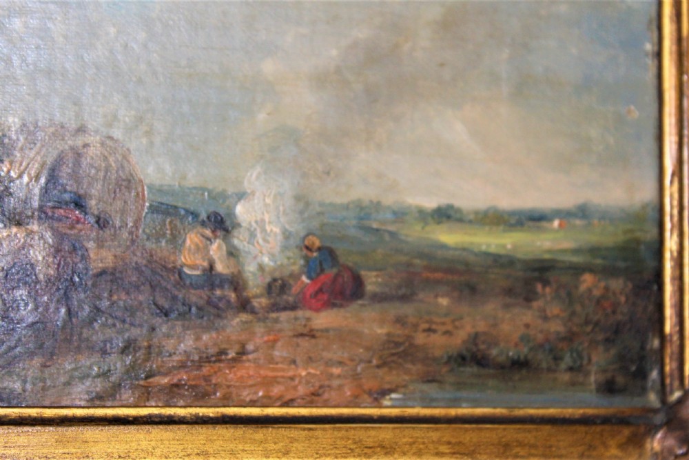 A small and charming well painted oil on panel depicting a couple sitting by a camp fire by a lake with a horse and wagon in the background  View V