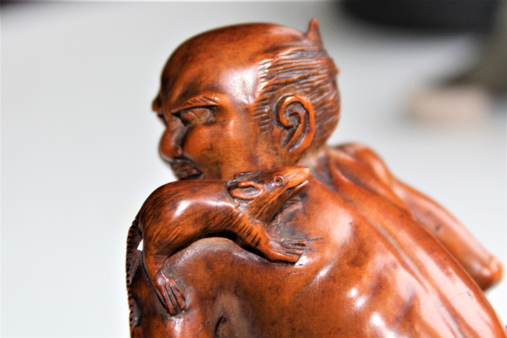 A superb and finely carved boxwood Okimono of the rat catcher Japanese Circa 1880  View VI