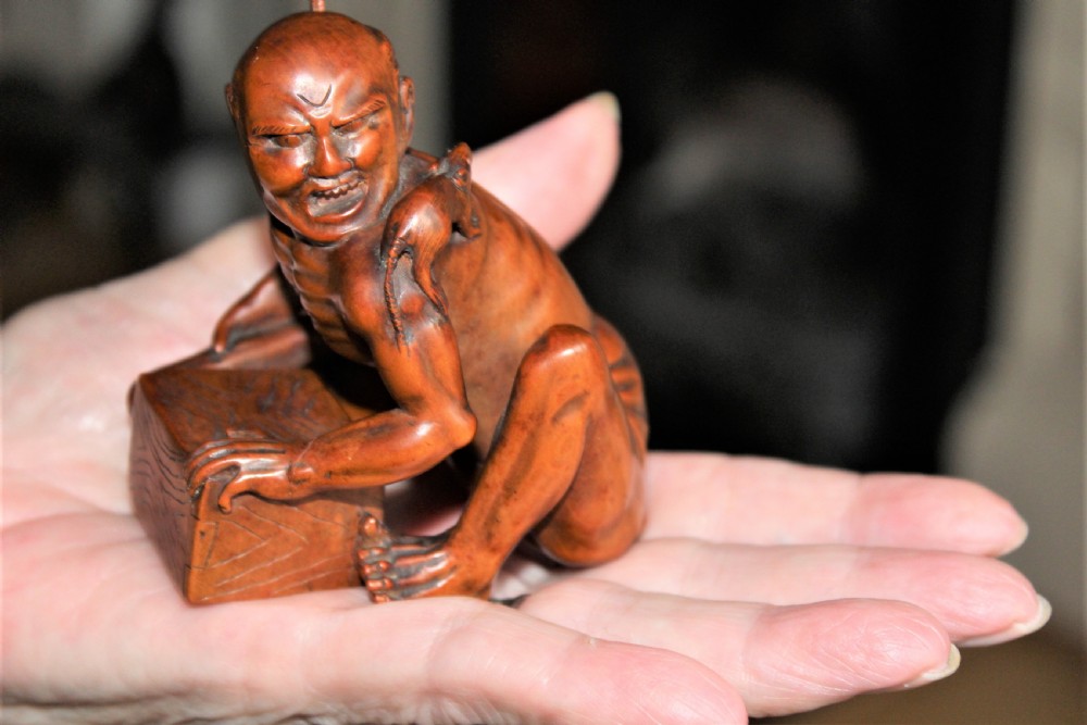 A superb and finely carved boxwood Okimono of the rat catcher Japanese Circa 1880  View VII
