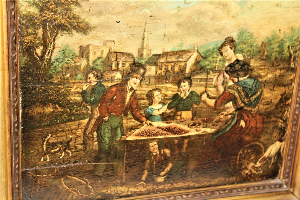 An antique oil painting on a wood panel depicting figures, children, and dogs in a rural village setting, enclosed in a gilded frame. View X