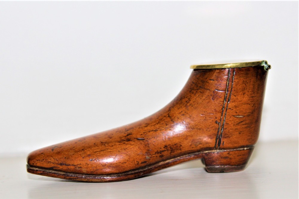 A very fine and tactile Georgian fruitwood snuff box in the shape of a shoe with a brass hinged lid and a brass horse shoe  View II