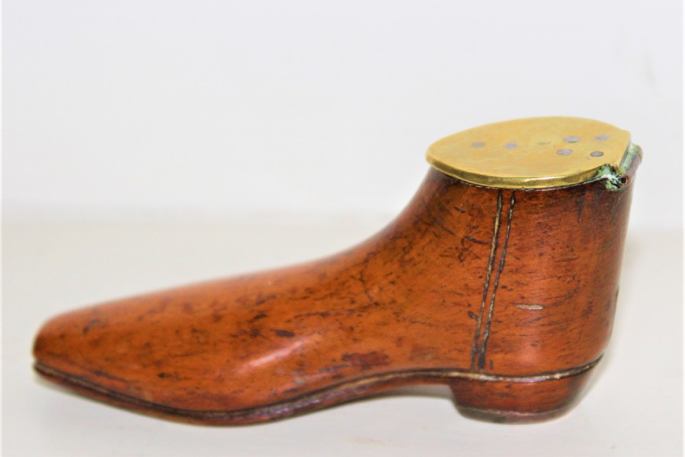 A very fine and tactile Georgian fruitwood snuff box in the shape of a shoe with a brass hinged lid and a brass horse shoe  View III
