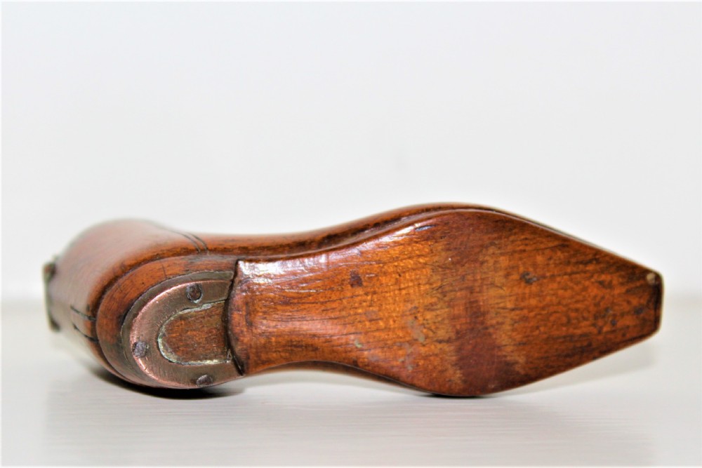A very fine and tactile Georgian fruitwood snuff box in the shape of a shoe with a brass hinged lid and a brass horse shoe  View V