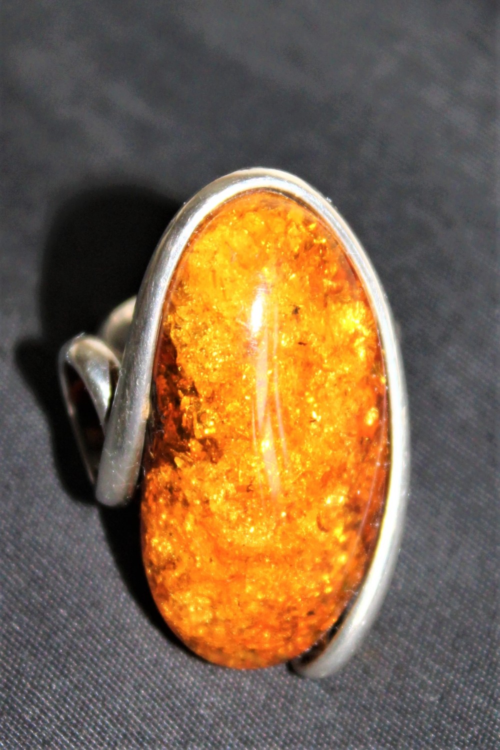 A very stylish heavy gauge silver and large amber stone ring hall marked possibly Danish 