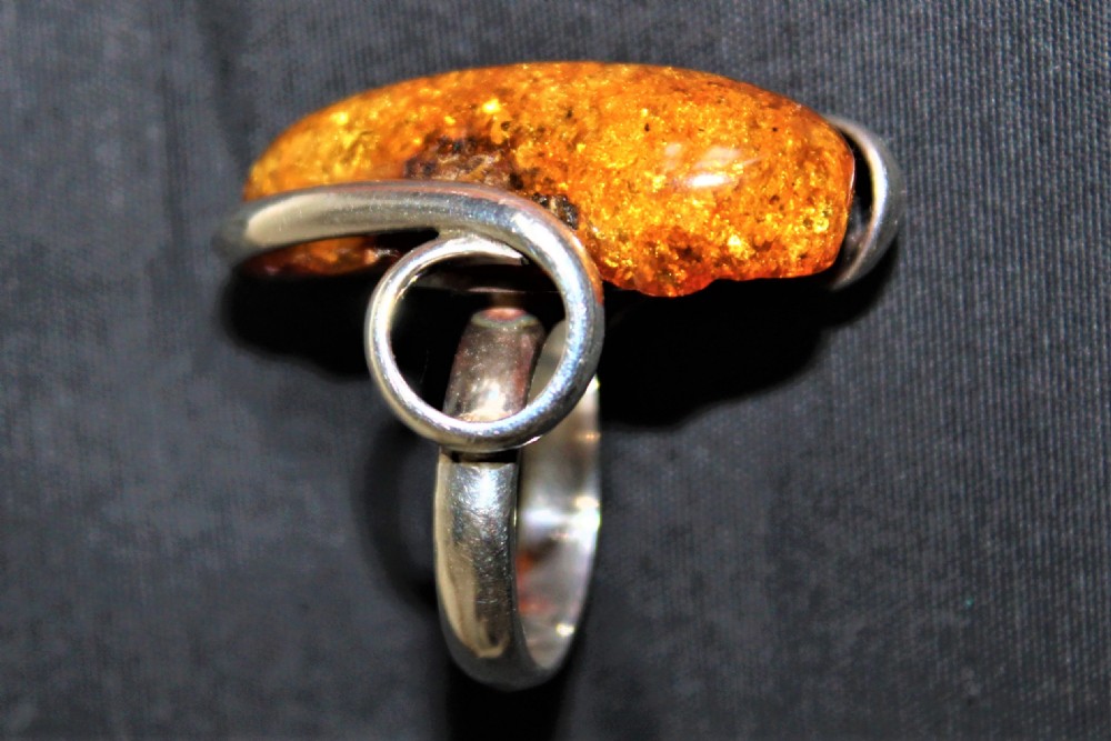 A very stylish heavy gauge silver and large amber stone ring hall marked possibly Danish  View V