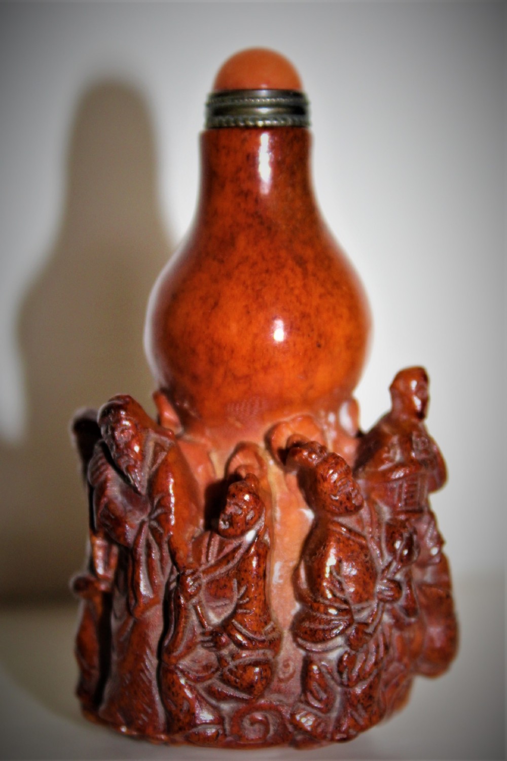 unusual Chinese carved deer antler snuff bottle. The stopper is fashioned from gilt metal and hard stone   