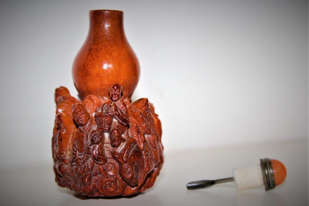 unusual Chinese carved deer antler snuff bottle. The stopper is fashioned from gilt metal and hard stone    View V