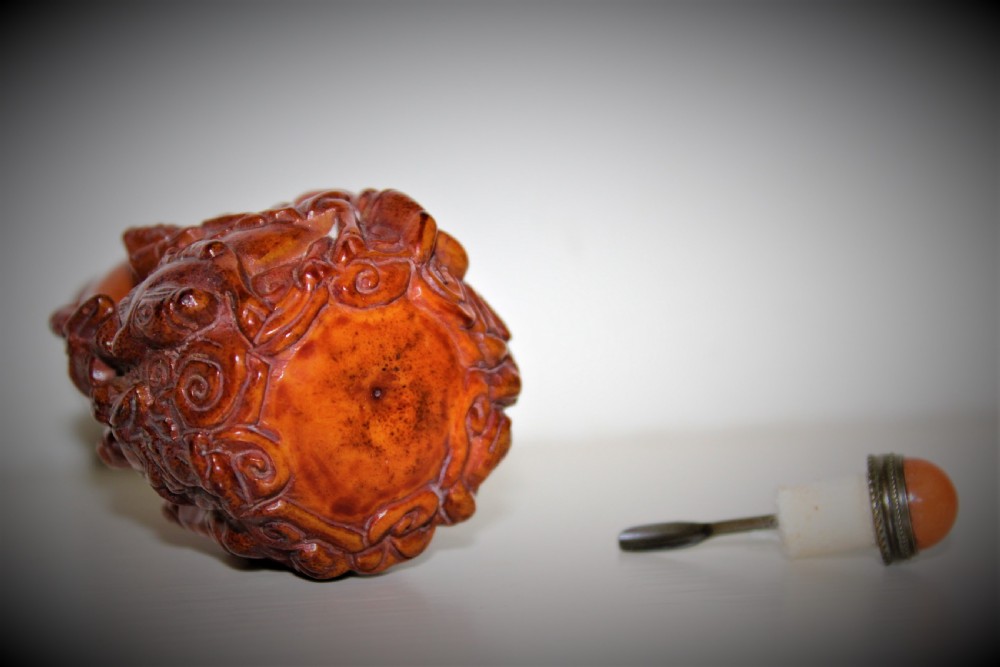 unusual Chinese carved deer antler snuff bottle. The stopper is fashioned from gilt metal and hard stone    View VI