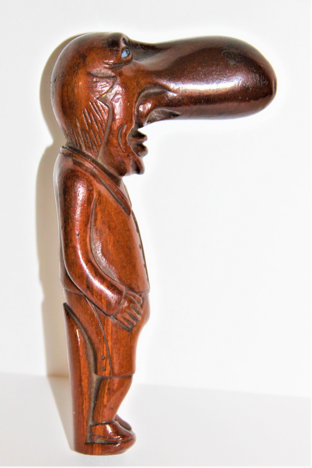An interesting and amusing hard wood carving of Ally Sloper with glass eyes
