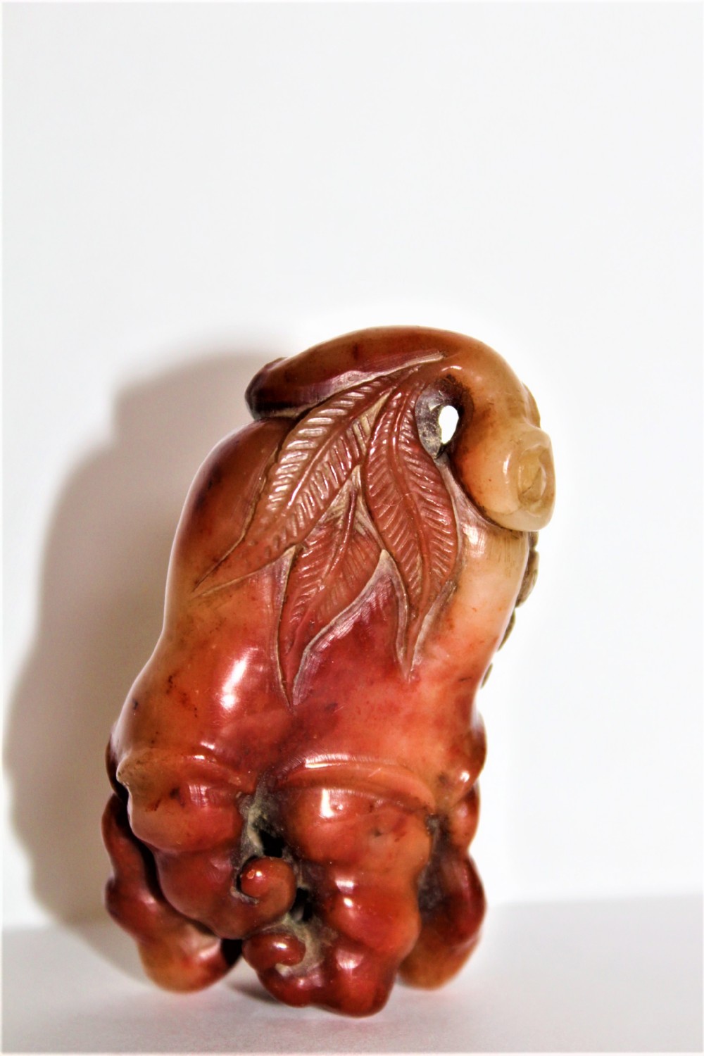 A superb  and tactile carved Chinese soapstone fruiting pod with a Bat feeding possibly a netsuke 