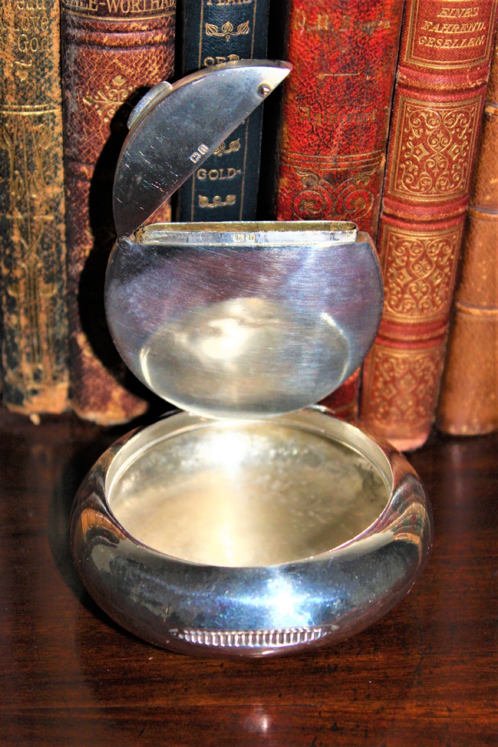 A rare silver circular tobacco box with a concealed vesta case in the lid 