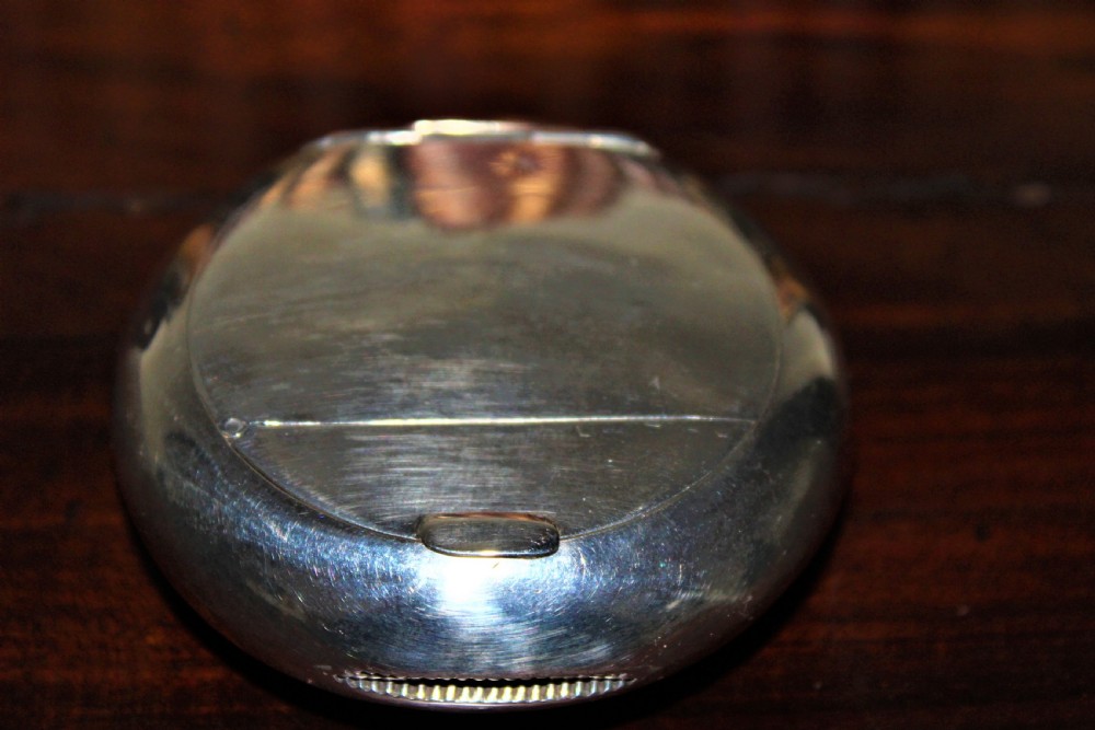 A rare silver circular tobacco box with a concealed vesta case in the lid  View IV
