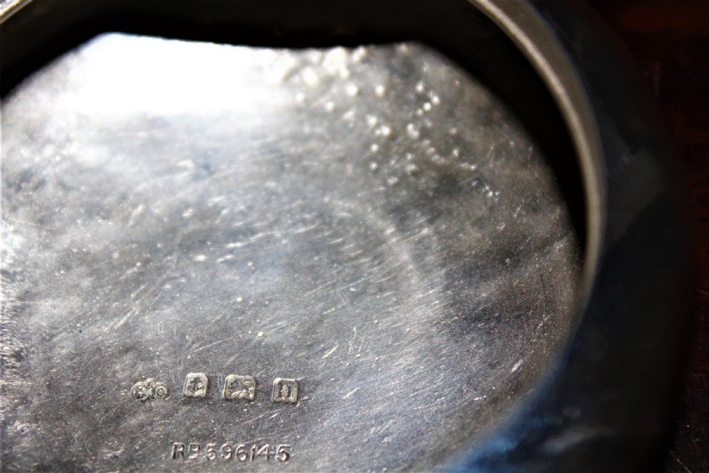 A rare silver circular tobacco box with a concealed vesta case in the lid  View V