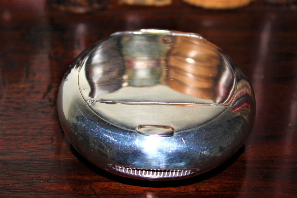 A rare silver circular tobacco box with a concealed vesta case in the lid  View VII
