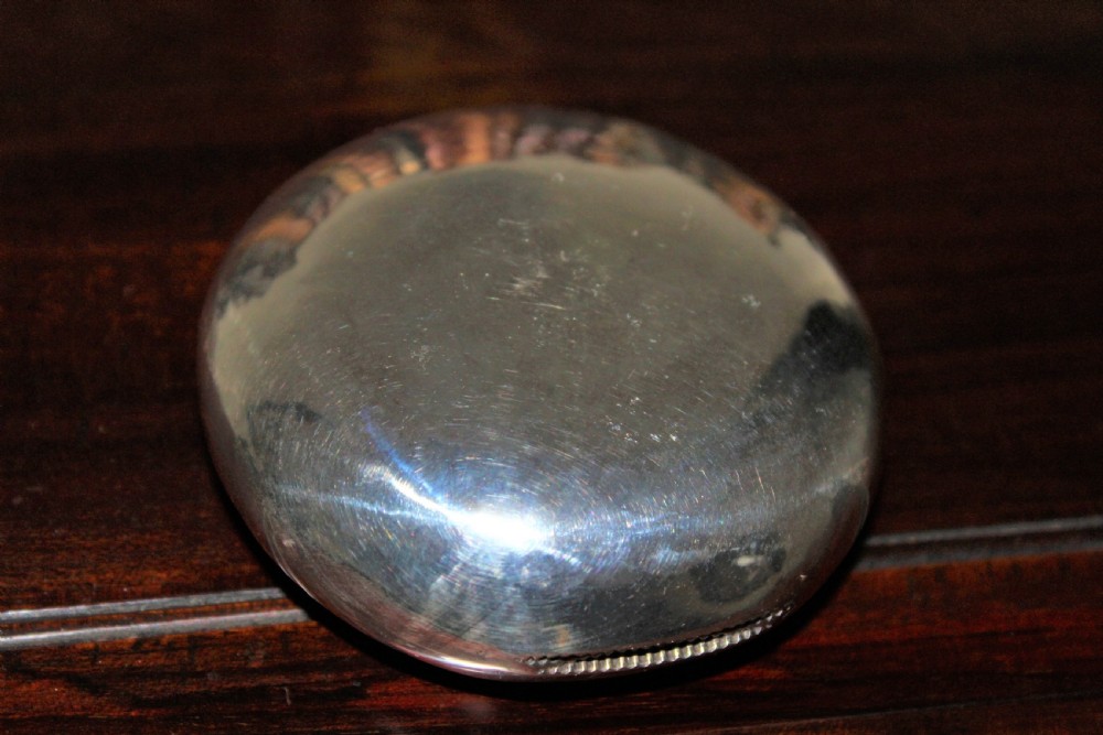 A rare silver circular tobacco box with a concealed vesta case in the lid  View X