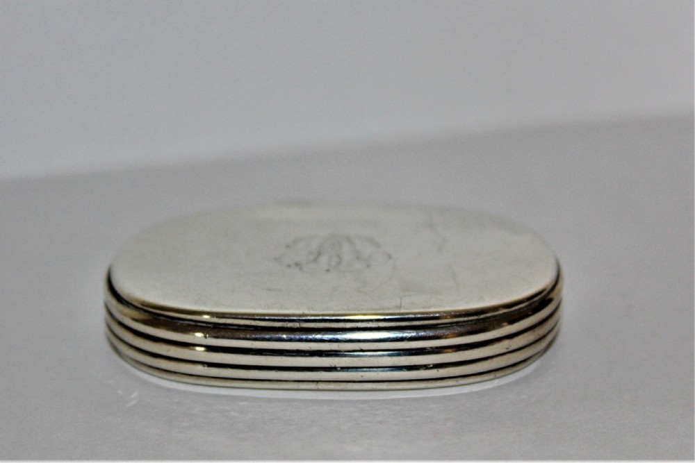 An unusual Victorian silver oval vesta case with reeded sides 