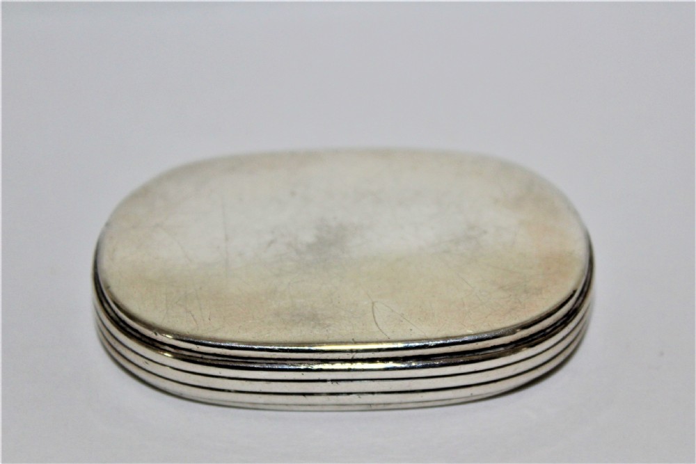 An unusual Victorian silver oval vesta case with reeded sides  View II