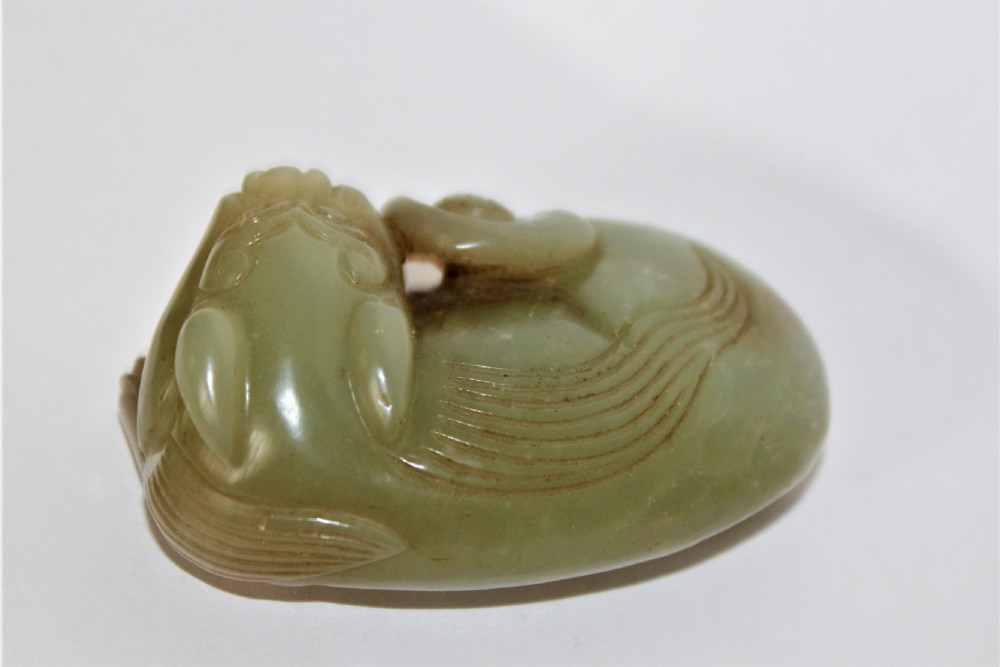 A finely carved Chinese celadon jade cat  View IV