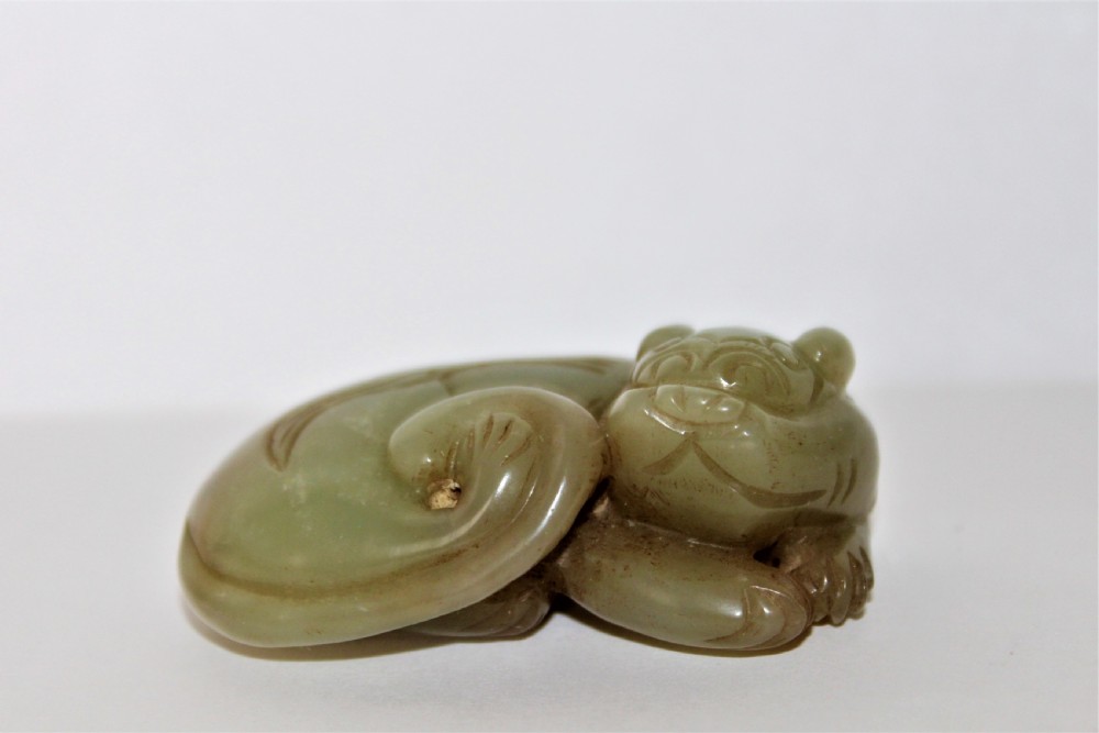 A finely carved Chinese celadon jade cat  View V