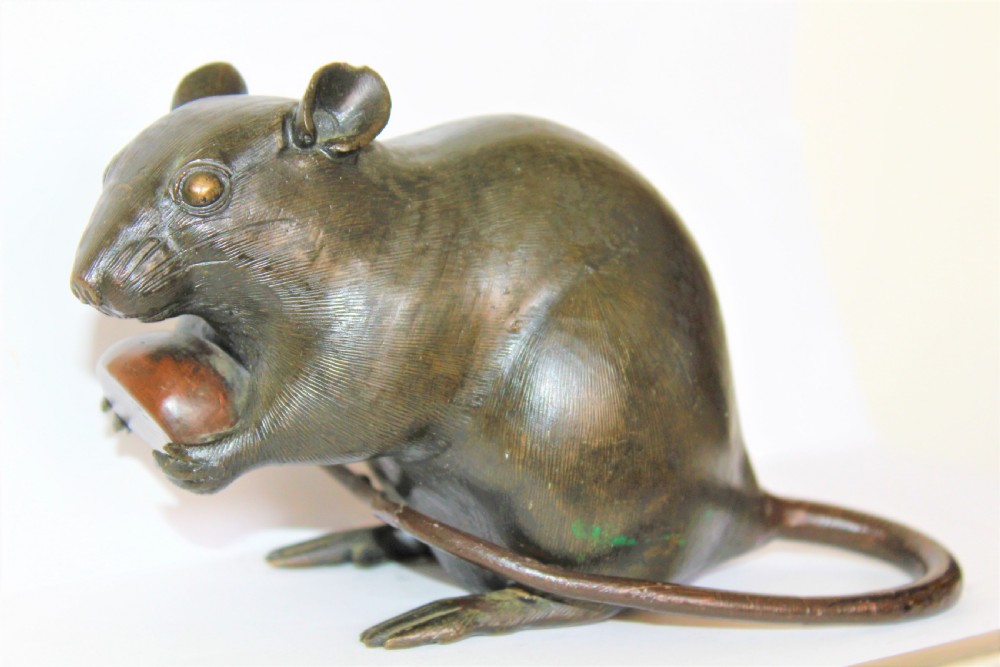 A well defined and chunky Japanese bronze model of a rodent and signed