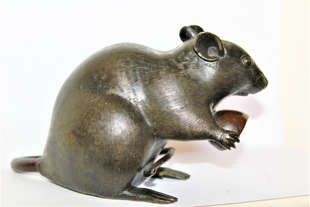 A well defined and chunky Japanese bronze model of a rodent and signed View IV