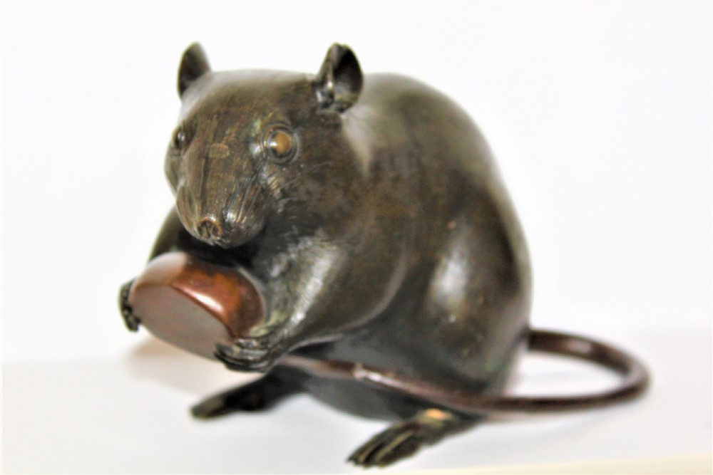 A well defined and chunky Japanese bronze model of a rodent and signed View V