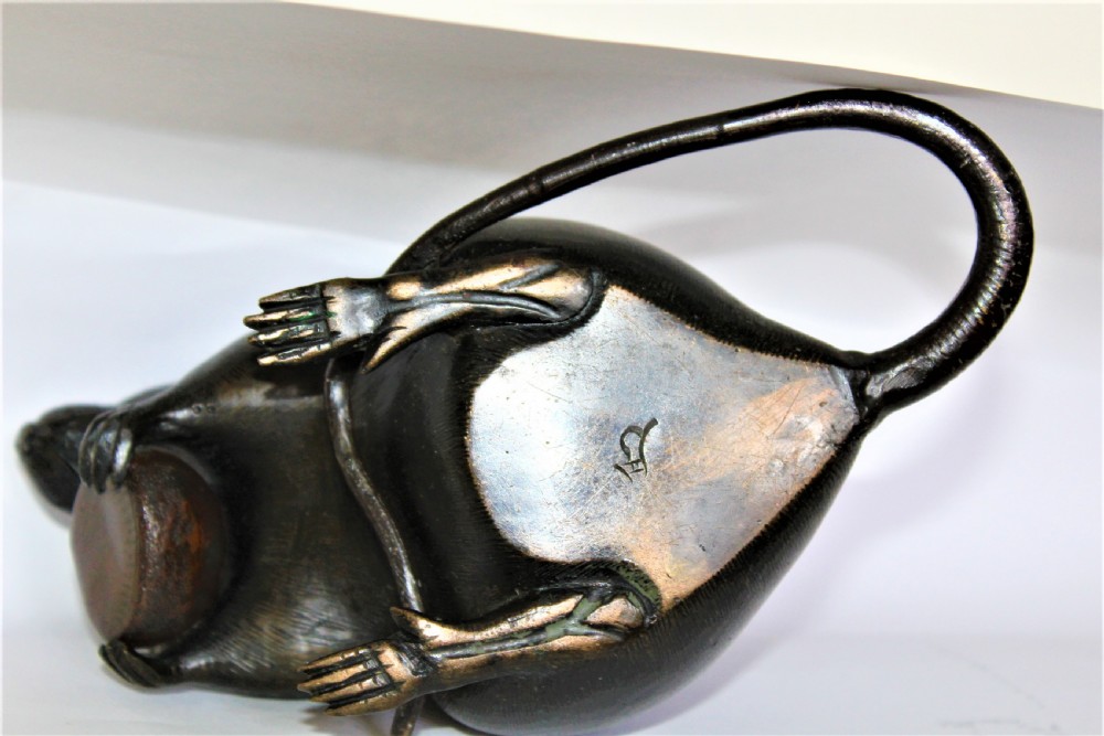 A well defined and chunky Japanese bronze model of a rodent and signed View VI