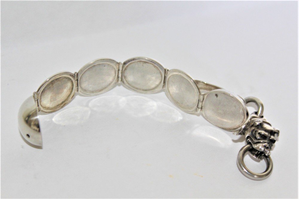 An interesting and unusual silver fob depicting a dogs head and ball  View V