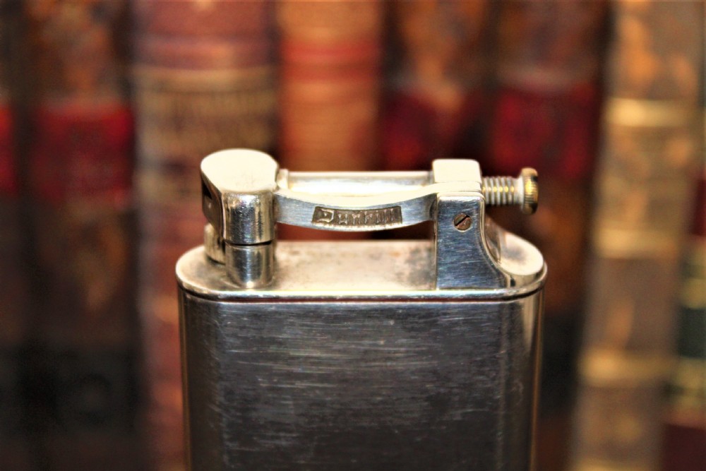 A Dunhill table petrol lighter in the original box  View V