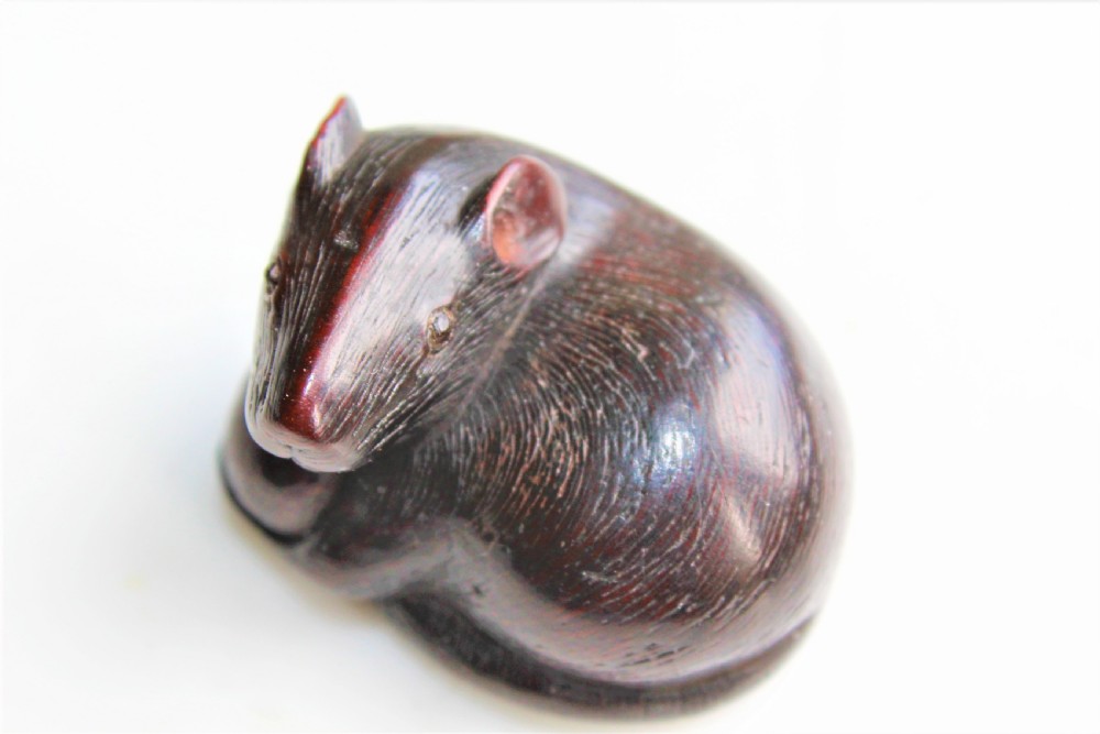 A finely carved wood netsuke modelled as a rodent View II
