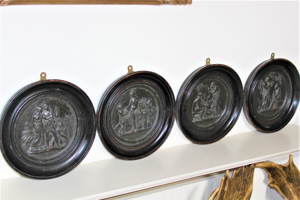 Set of four Grand Tour classical bronze plaques in relief 