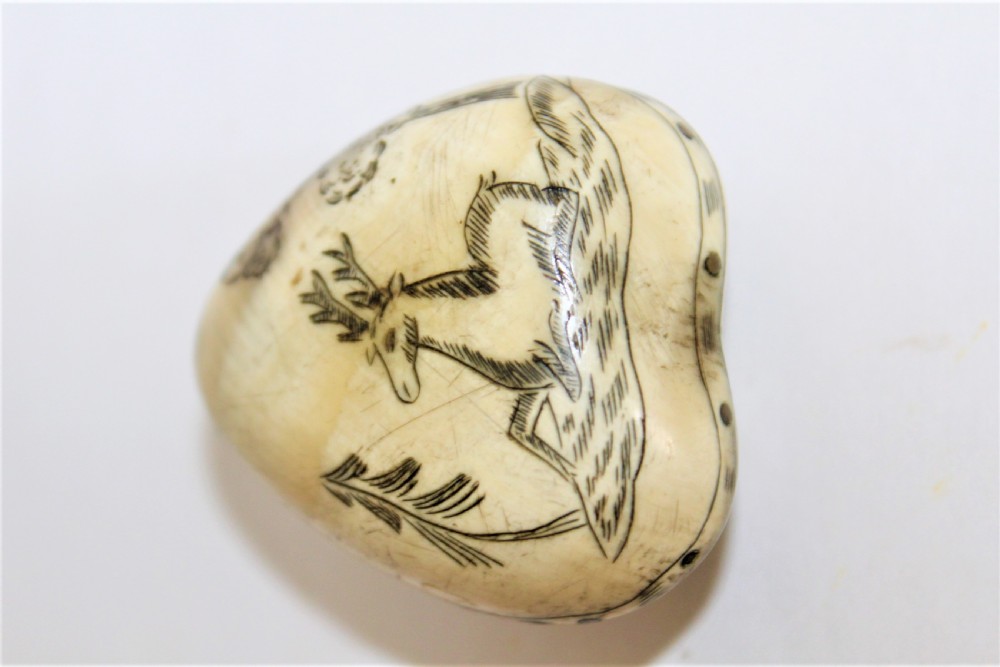 A 19th century small heart shaped horn box, possibly a love token  View III