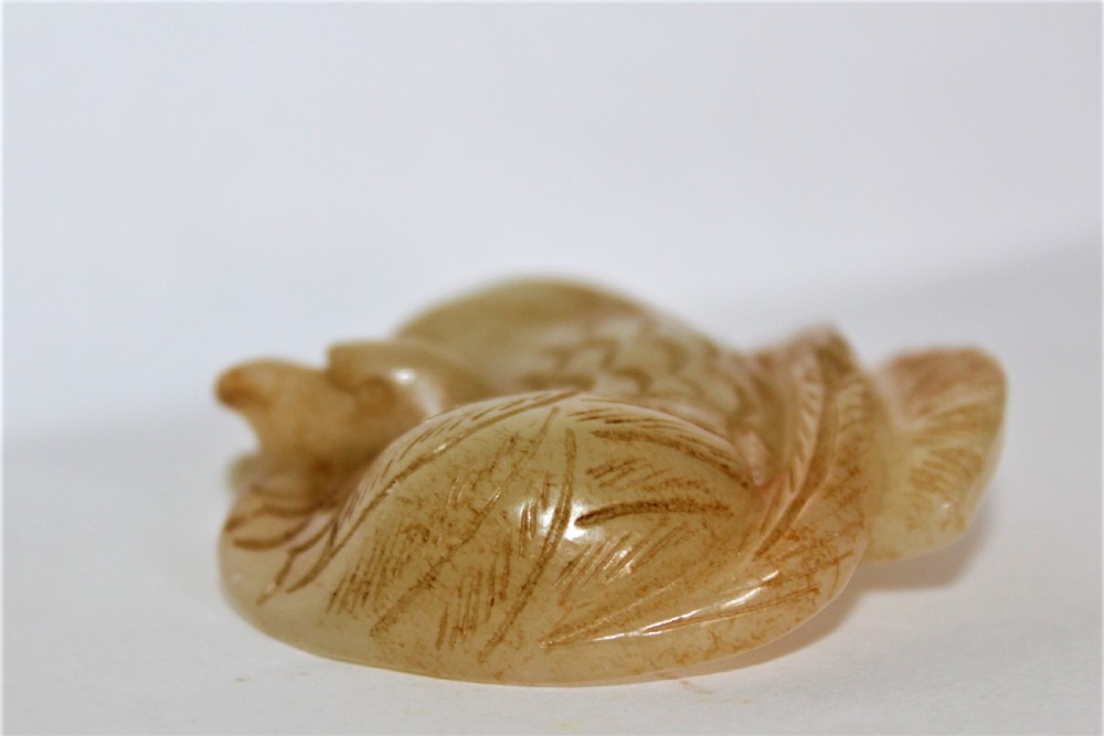 A Chinese mythical bird pendant stylishly carved in jade  View II