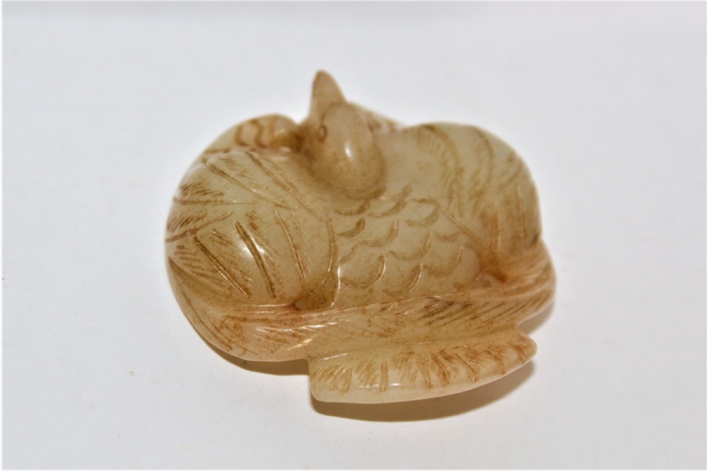 A Chinese mythical bird pendant stylishly carved in jade  View V