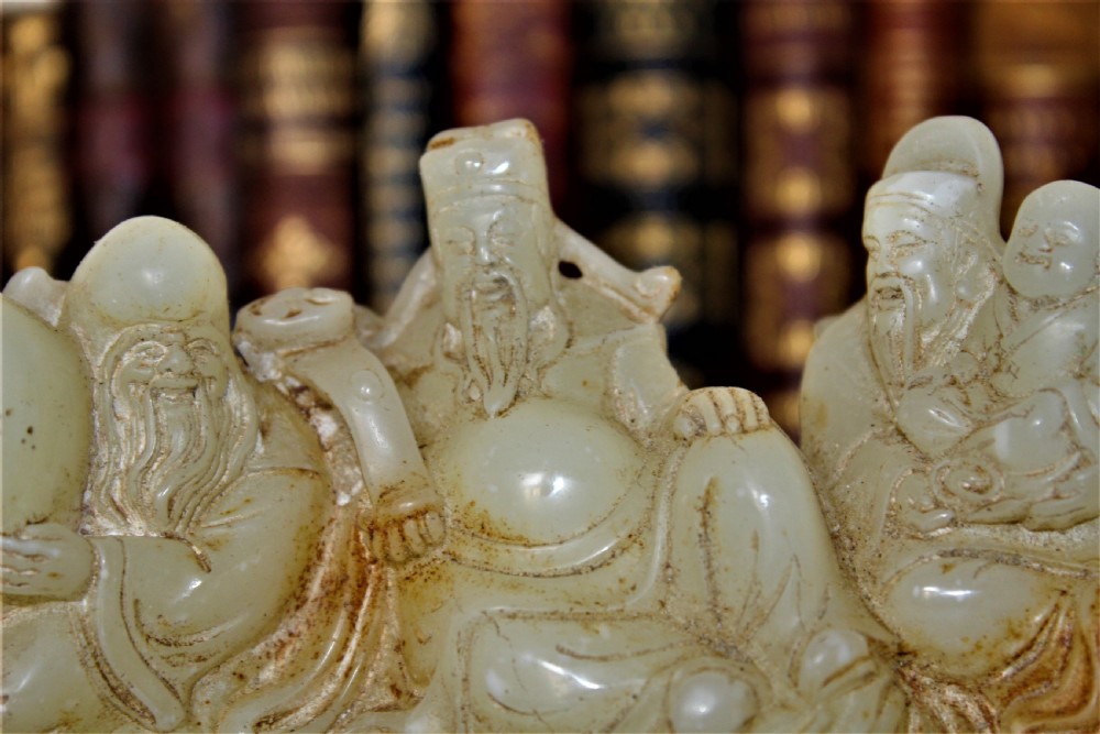 A finely carved Chinese hardstone possibly jade figural brush rest  View III
