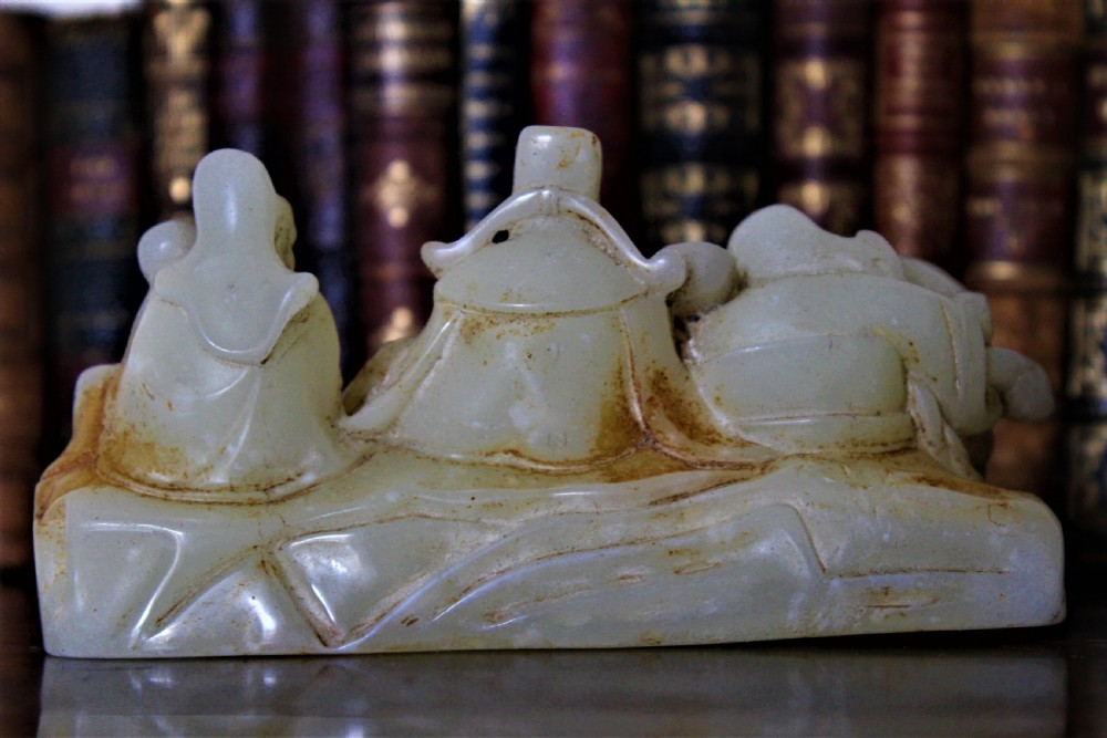 A finely carved Chinese hardstone possibly jade figural brush rest  View IV
